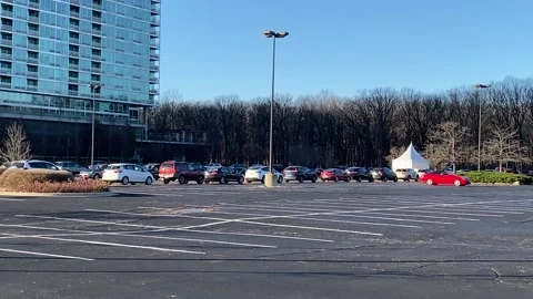 Vehicles lined up at COVID drive-thru testing site Stock Footage 143328862