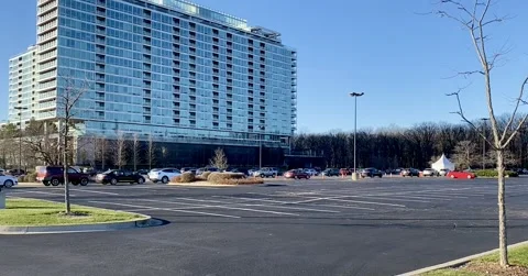 Vehicles lined up at COVID drive-thru testing site Stock Footage 143328872