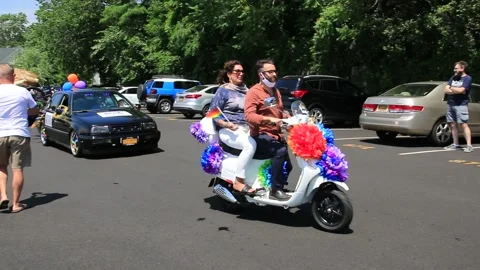 Vehicles lining up to start Gay Pride Car Parade in Babylon Village 6858 Stock Footage 135969457
