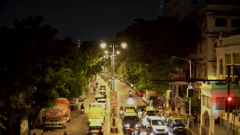 Vehicles move through a busy city road Stock Footage 337172287