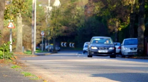Vehicles moving up down a road on a hill Stock Footage 43744292
