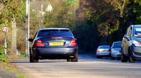 Vehicles moving up down a road on a hill Stock Footage 43745261