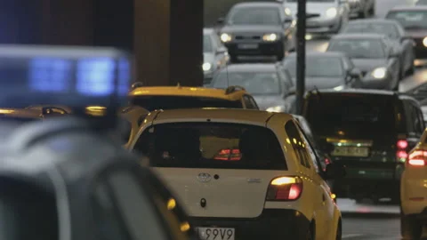 Vehicles Moving Slowly in a Traffic Jam. Police Car Stock Footage 88028432
