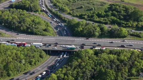 Vehicles Navigate Congested Multi-Level Motorway on Sunny Day Stock Footage 335292408