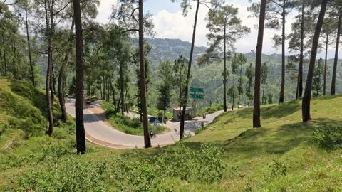 Vehicles Navigating Curvy Himalayan Highway Surrounded By Green Valley Stock Footage 337913883