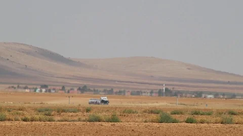 Vehicles pass through the road in the middle of the steppe. Extreme hot weather Stock Footage 114116838