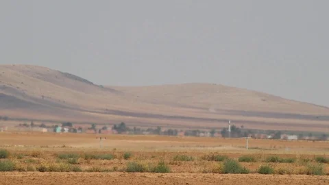 Vehicles pass through the road in the middle of the steppe,extreme hot weather 3 Stock Footage 114116858