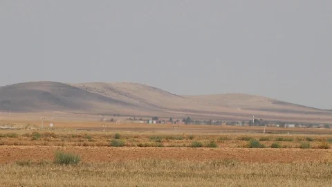 Vehicles pass through the road in the middle of the steppe,extreme hot weather 4 Stock Footage 114116872