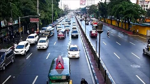 Vehicles passing along a major road in Manila City, Philippines. Stock Footage