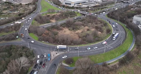 Vehicles passing large multilane roundabout, traffic in suburb Video stock 170907883