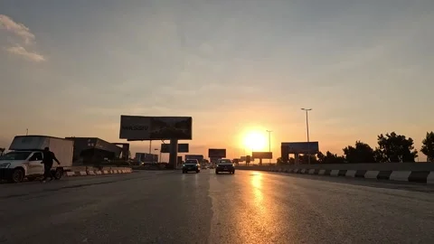 Vehicles Passing Through Desert Landscape Highway From Cairo Toward Ain Sokhna Stock Footage 329982531