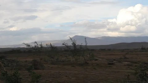 Vehicles Passing Through Rift Valley Kenya (HD) Stock Footage 8795537