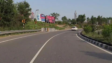 Vehicles passing through a road Stock-Footage 264844617