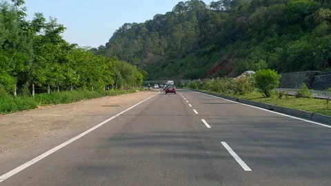 Vehicles passing through a road Stock Footage 264844654