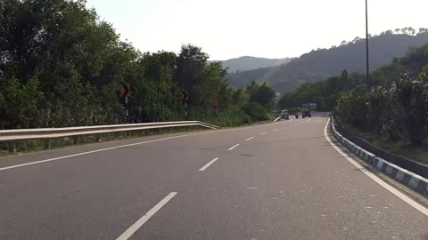 Vehicles passing through a road Stock-Footage 264844721
