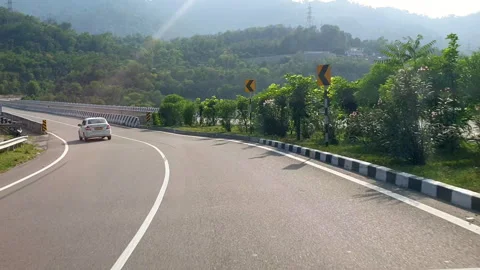 Vehicles passing through a road Stock-Footage 264844913