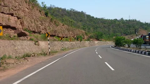 Vehicles passing through a road Stock Footage 264845060