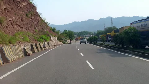 Vehicles passing through a road Stock Footage 264845079