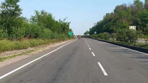 Vehicles passing through a road Stock Footage 264845216