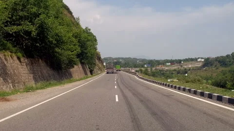 Vehicles passing through a road Stock Footage 264845458