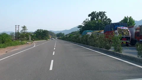 Vehicles passing through a road Stock Footage 264845547