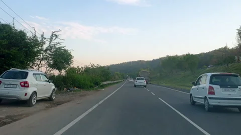 Vehicles passing through a road Stock Footage 264845797
