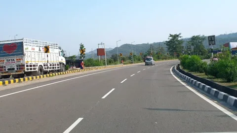 Vehicles passing through a road Stock Footage 264845976