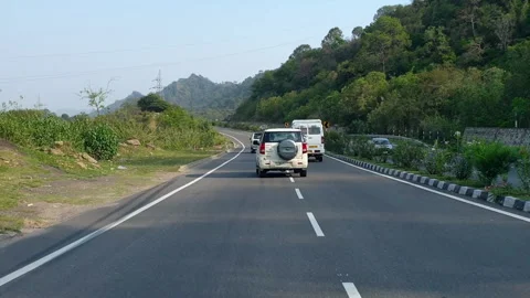 Vehicles passing through a road Stock Footage 264846079