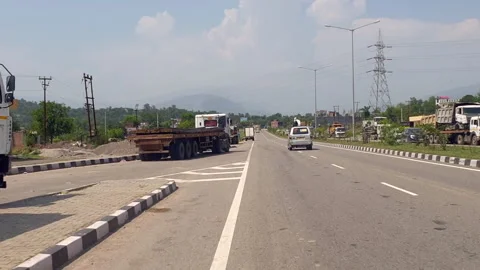 Vehicles passing through a road Stock Footage 264846389