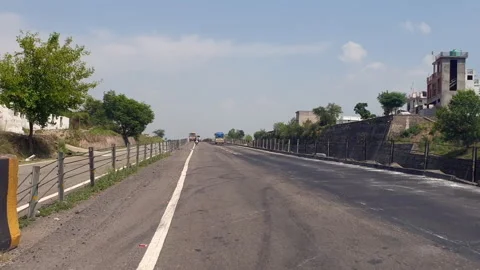 Vehicles passing through a road Stock Footage 264846605