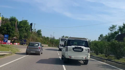 Vehicles passing through a road Stock Footage 264846754