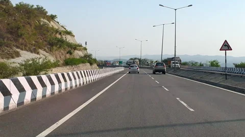 Vehicles passing through a road Stock Footage 264846759