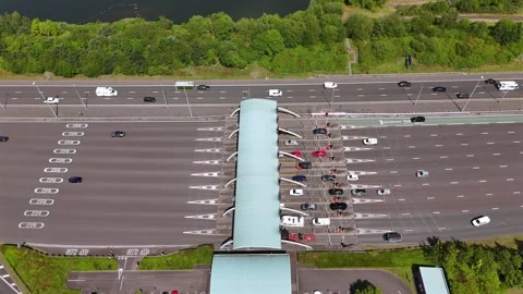 Vehicles Passing Through a Toll Booth on a Motorway Stock Footage 281354924