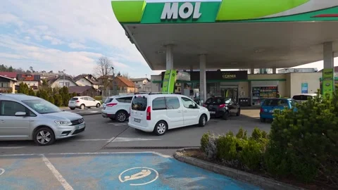 Vehicles queue at local gas station during global energy supply crisis Stock Footage 333464596