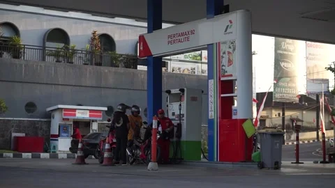Vehicles queue at the Pertamina gas station Stock Footage 295870293