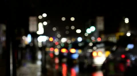 Vehicles in the rain at night defocused Stock Footage 10565442