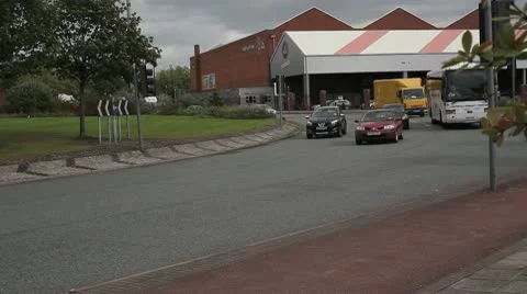 Vehicles on roundabout-dark day Stock Footage 10703227