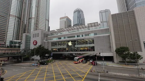 Vehicles run under an Apple store at IFC  in Hong Kong Central Stock Footage 45135315