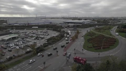 Vehicles stopping at roundabout near elevated highway Stock-Footage 167902804