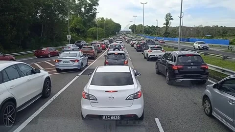 Vehicles Stuck in Slow-Moving Rush Hour Traffic Congestion on Highway Video Stock Footage 307315831