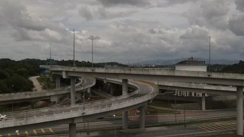 Vehicles traffic flow highway flyover overpass lanes at Puncak Perdana Selangor Stock Footage 231103818