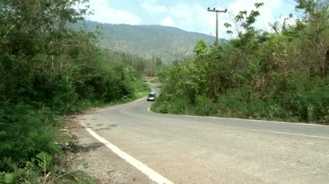 Vehicles Wind Their Way Up A Mountain Road 스톡 동영상 12558159