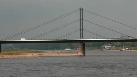 Vehicular traffic on a large cable-stayed  Oberkassel bridge. Dusseldorf Stock Footage 42143371