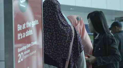 Veiled Female Passenger Doing Self Check-In Stock Footage 65729465