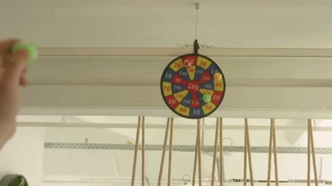 Velcro disk with three balls fourth ball throwing out a hand Stock Footage 203896884