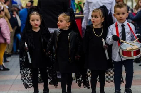 VELEZ-MALAGA, SPAIN - MARCH 24, 2018 Children participating in the procession Stock Photos