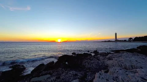 Veli Rat lighthouse at sunset time lapse Stock Footage 63257154