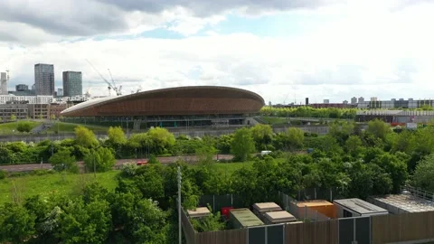 Velopark cycling hall in Olympic park behind busy multilane road Video stock 155849092