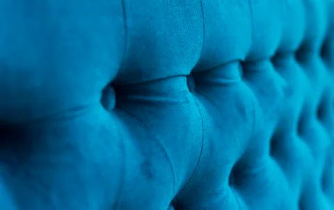 Velour surface of sofa close-up. Coach-type velours screed tightened with Foto stock