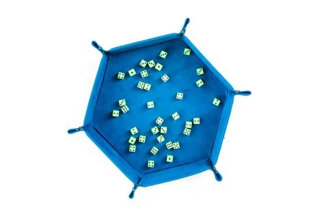 Velvet snap together cup with tiny green neon dice top down over white Stock Photos